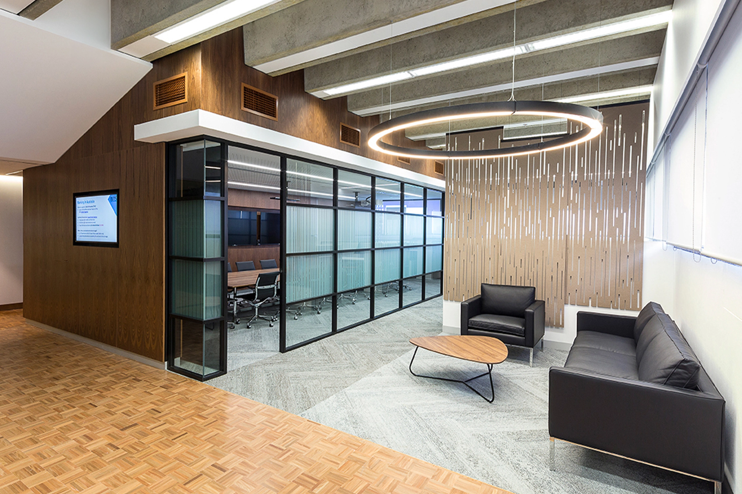 UTS Building 1 Levels 20–21 workplace refurbishment, designed by Wetherill Architects, with glass meeting room and circular feature light