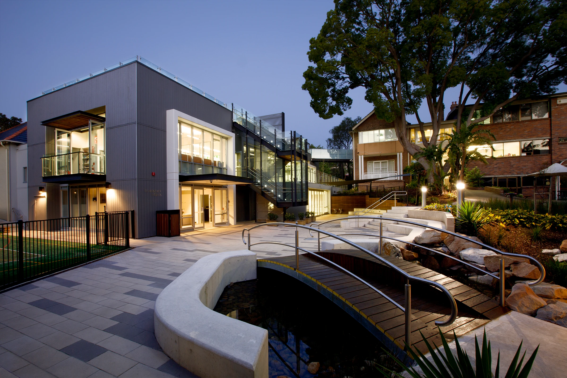 Wenona Woodstock Junior School courtyard and two-storey teaching and learning building at dusk