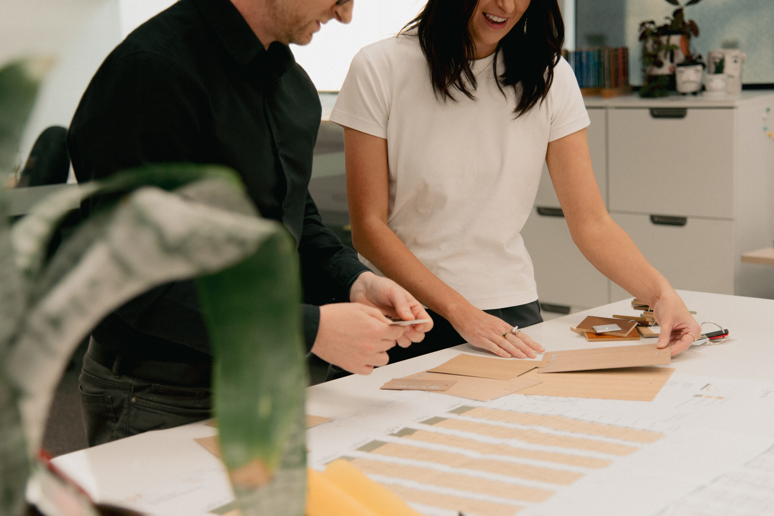 Two architects at Wetherill Architects, collaborating over architectural design concepts